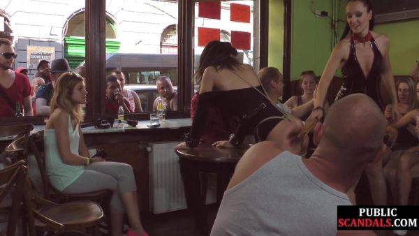 BDSM public slut whipped in public pub in front of voyeurs on allbdsmporn.com