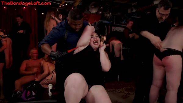 Busty BDSM public redhead whipped in front of voyeurs on allbdsmporn.com